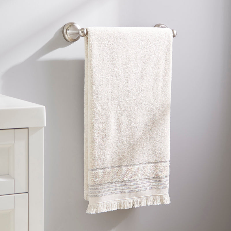 Jude Fringe Bath Towel, Beige, hanging on towel rack