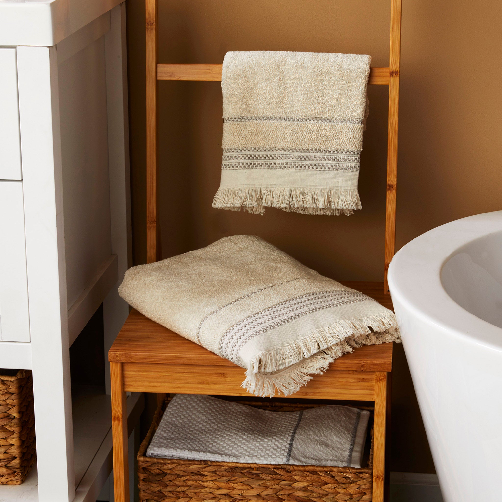 Jude Fringe Towels, Beige, displayed in bathroom