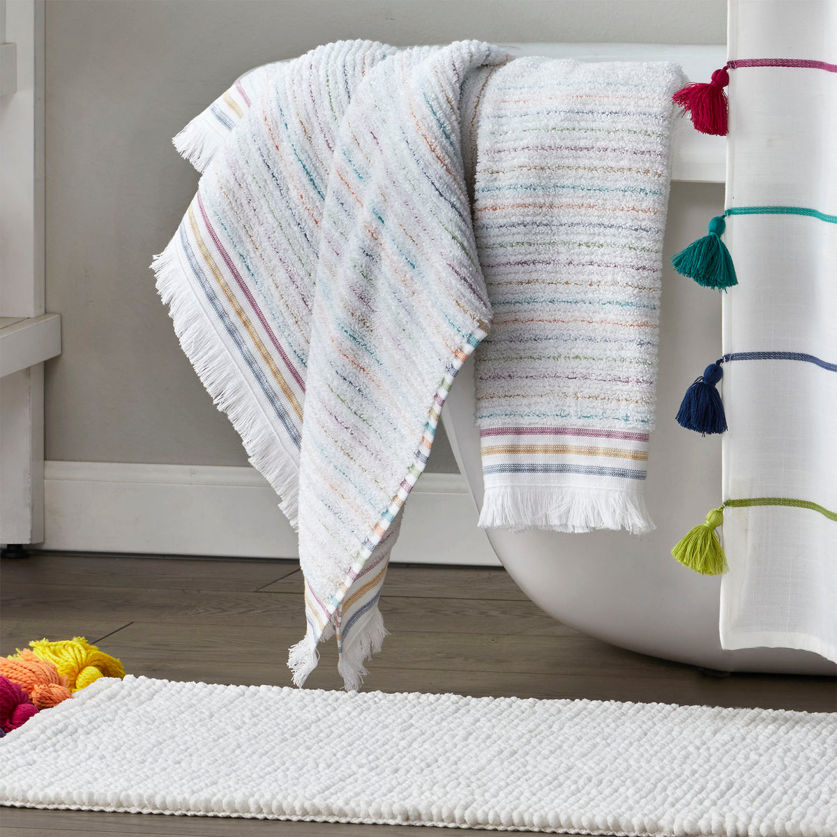 Subtle Stripe Towels, White Multi, Lifestyle, displayed on side of bathtub